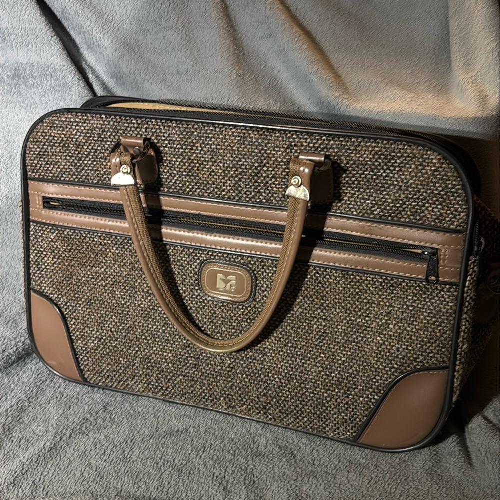 Vintage 1980s Diane Von Furstenberg tweed suitcase with leather trim.